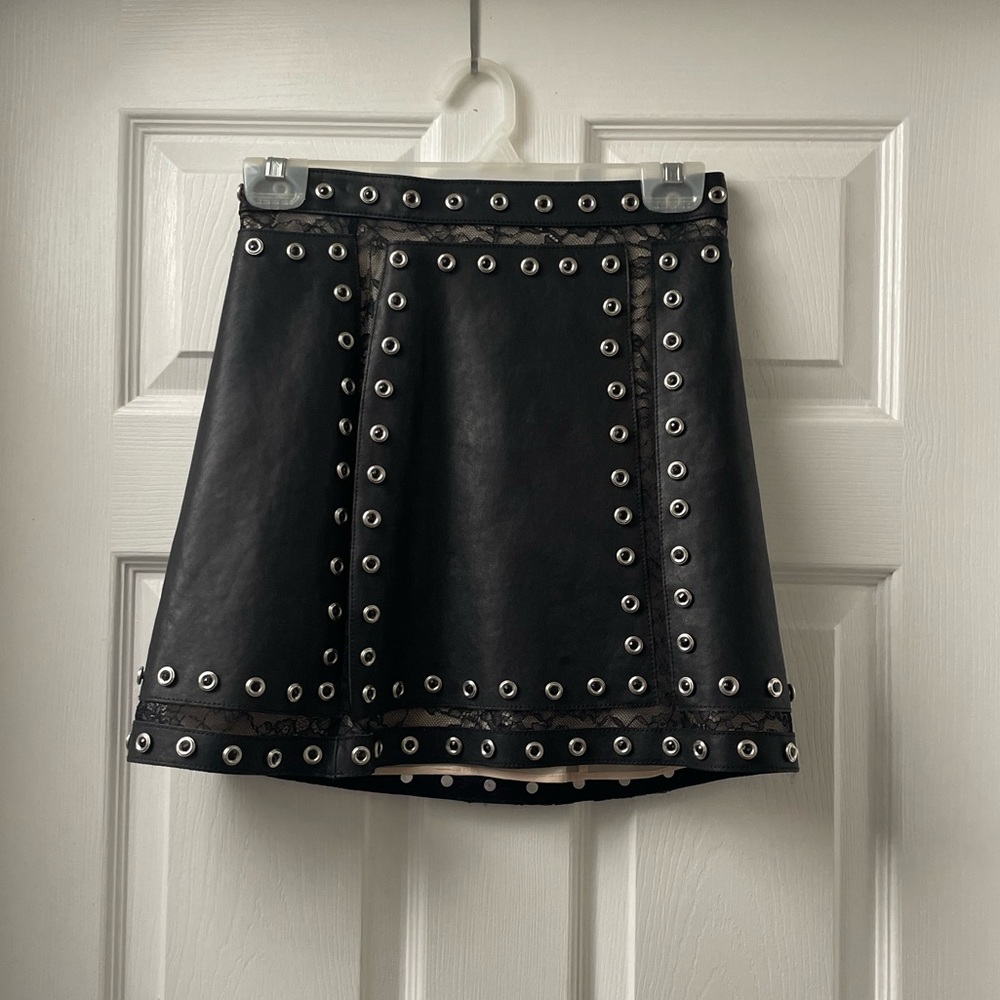 Alice + Olivia Black Faux Leather Mini Skirt with Silver Eyelet Trim